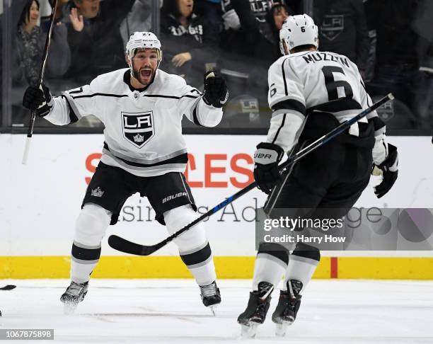 Alec Martinez of the Los Angeles Kings celebrates his goal with Jake Muzzin to take a 1-0 lead over the Carolina Hurricanes during the third period...