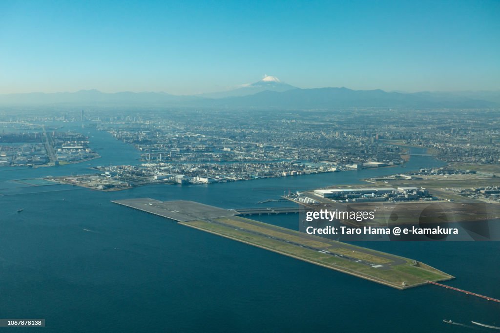 Mt. Fuji and Tokyo Haneda International Airport daytime aerial view from airplane