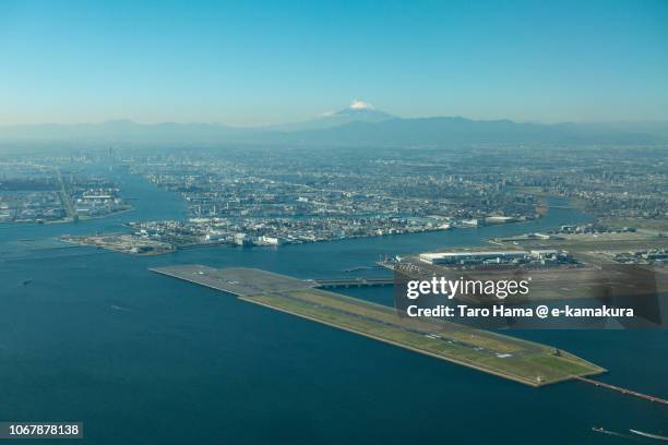 mt. fuji and tokyo haneda international airport daytime aerial view from airplane - tokyo international airport stock pictures, royalty-free photos & images