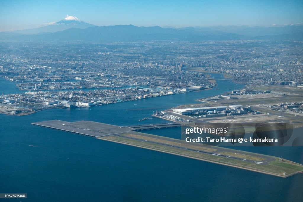 Mt. Fuji and Tokyo Haneda International Airport daytime aerial view from airplane