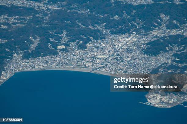 sagami bay and center of kamakura city in kanagawa prefecture in japan daytime aerial view from airplane - kamakura stock pictures, royalty-free photos & images