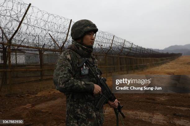 South Korean soldier stands guard at the gate of the Demilitarized Zone on December 3, 2018 in DMZ, South Korea. The two Koreas connected the...