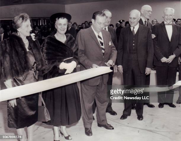 The ribbon cutting ceremony for the Solomon R. Guggenheim Museum of art in Manhattan on October 21, 1959. Cutting the ribbon, from left to right are:...