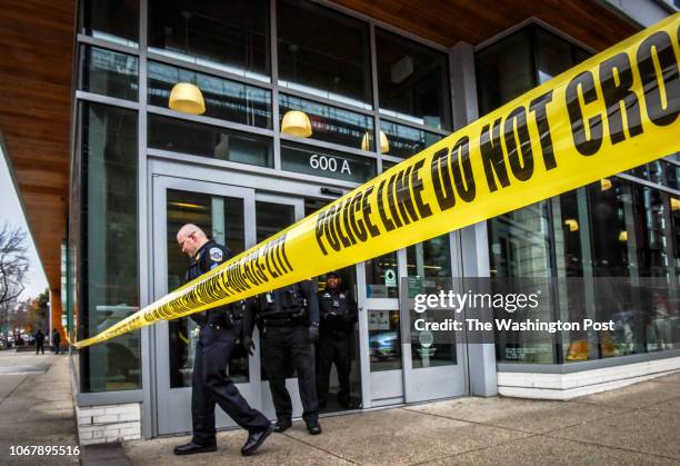 Police investigate a shooting in connection with a robbery attempt at the Whole Foods on H street, NE, on December 2018 in Washington, DC.