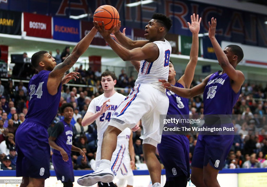 DeMatha guard Earl Timberlake drives to the hoop past several Gonzaga DeMatha guard Earl Timberlake drives to the hoop past several Gonzaga