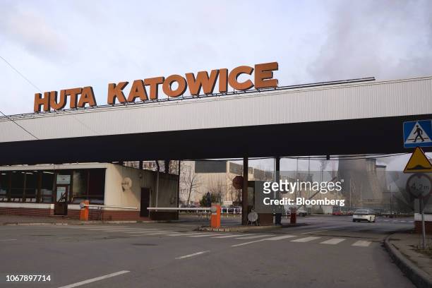 Sign stands above the entrance gate to the Huta Katowice steel plant in Dabrowa Gornicza, Poland, on Tuesday, Nov. 27, 2018. Katowice is the capital...