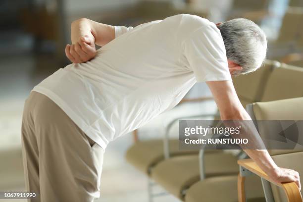 senior man suffering from backache - 腰痛 ストックフォトと画像