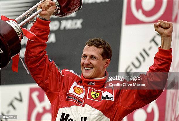Michael Schumacher of Germany and the Ferrari team celebrates winning the World Championship at the Japanese Formula One Grand Prix in Suzuka, Japan....