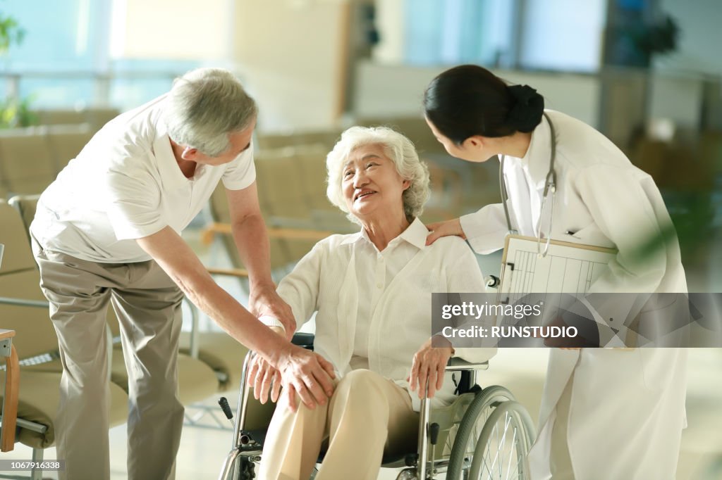 Senior couple talking with doctor