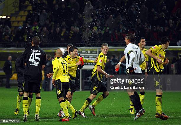 Nuri Sahin and Sven Bender of Dortmund celebrate with team mates after winning the Bundesliga match between Borussia Dortmund and Hamburger SV at...