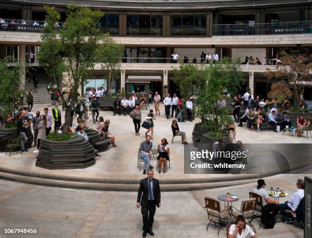 city of london's broadgate circle at lunchtime - broadgate stock pictures, royalty-free photos & images
