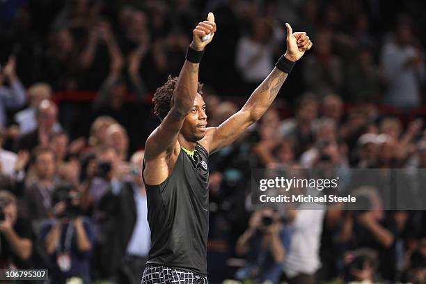 Gael Monfils of France salutes the crowd following his 6-2,2-6, 6-3 quarter-final victory against Andy Murray of Great Britain during Day Six of the...