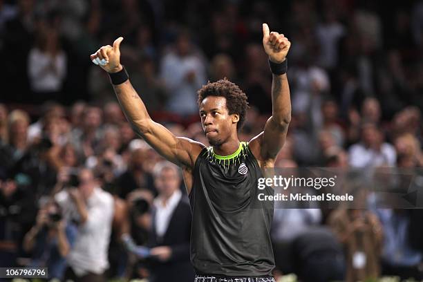 Gael Monfils of France salutes the crowd following his 6-2,2-6, 6-3 quarter-final victory against Andy Murray of Great Britain during Day Six of the...