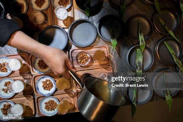 Chef prepares a hot beer dish at Na-Oh Bangkok inside Chang Chui market on December 1, 2018 in Bangkok, Thailand. A fine-dining restaurant set inside...