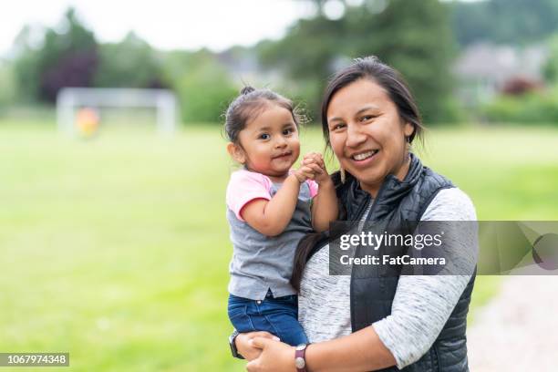 portrait of a native american mother and daughter outside - single mother portrait stock pictures, royalty-free photos & images