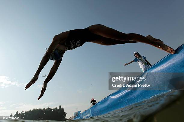 Akane Tsuchihashi of Japan competes in the Women's Individual Triathlon at the Triathlon Venue during day one of the 16th Asian Games Guangzhou 2010...