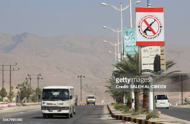 Sign prohibiting civilians from bearing firearms hangs in the former Al-Qaeda in the Arabian Peninsula jihadist's bastion of Mukalla in Yemen's...