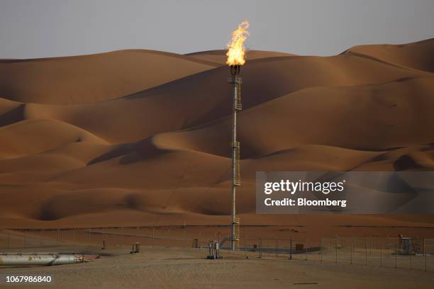 Flames burn off at an oil processing facility in Saudi Aramco's oilfield in the Rub' Al-Khali desert in Shaybah, Saudi Arabia, on Tuesday, Oct. 2,...