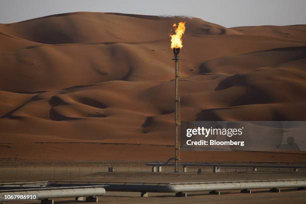 Flames burn off at an oil processing facility in Saudi Aramco's oilfield in the Rub' Al-Khali desert in Shaybah, Saudi Arabia, on Tuesday, Oct. 2,...