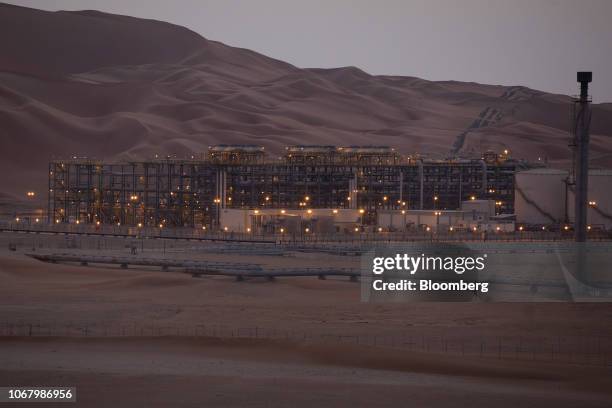 Lights illuminate the oil processing facility in Saudi Aramco's oilfield in the Rub' Al-Khali desert in Shaybah, Saudi Arabia, on Tuesday, Oct. 2,...