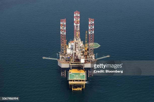 An offshore drilling platform stands in shallow waters at the Manifa offshore oilfield, operated by Saudi Aramco, in Manifa, Saudi Arabia, on...