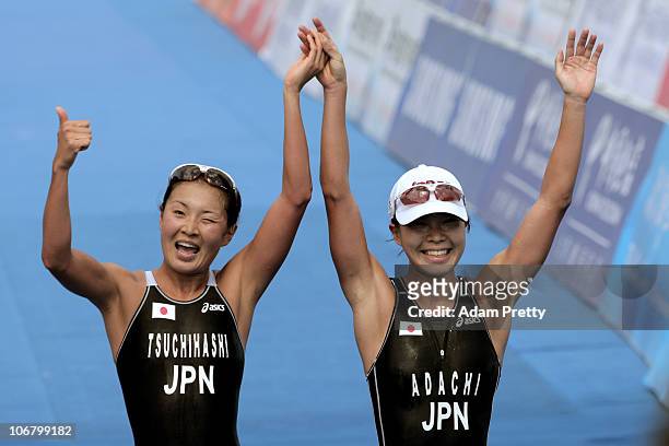 Mariko Adachi of Japan celebrates with teammate Akane Tsuchihashi of Japan after winning the gold and silver medals respectively in the Women's...