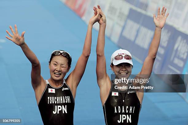 Mariko Adachi of Japan celebrates with teammate Akane Tsuchihashi of Japan after winning the gold and silver medals respectively in the Women's...