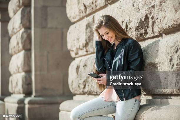 excited student reading news on a smart phone - draft media opportunity stock pictures, royalty-free photos & images