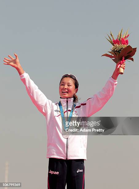 Akane Tsuchihashi of Japan celebrates with the Silver medal won in the Women's Individual Triathlon at the Triathlon Venue during day one of the 16th...