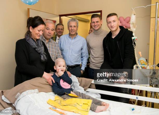 Marco Reus, Lukasz Piszczek and head coach Lucien Favre of Borussia Dortmund during the annual visit at the Children's Hospital on December 03, 2018...