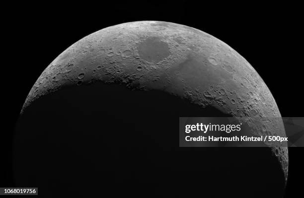 moon shrouded in darkness - waxing stock pictures, royalty-free photos & images