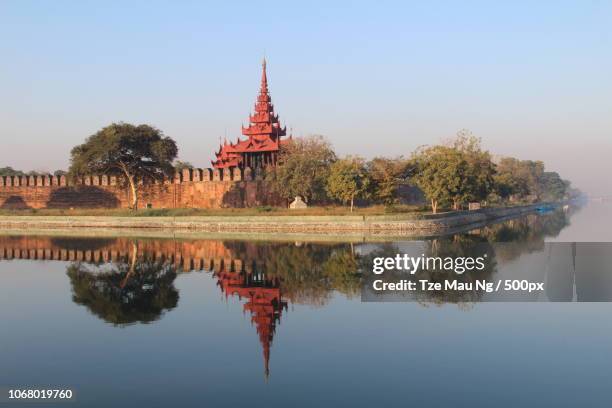 red pagoda on island, mandalay, myanmar - mandalay stock pictures, royalty-free photos & images