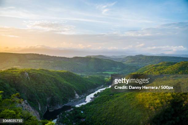 picturesque landscape with river and forest on hills - central america landscape stock pictures, royalty-free photos & images