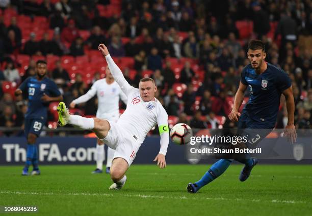 Wayne Rooney of England attempts to reach the ball as Matthew Miazga of United States looks on during the International Friendly match between...