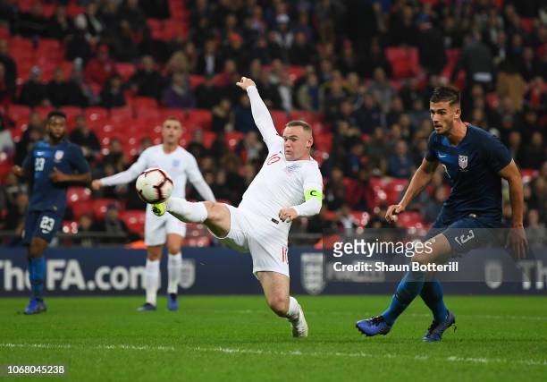 Wayne Rooney of England attempts to reach the ball as Matthew Miazga of United States looks on during the International Friendly match between...