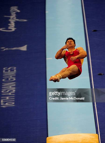 Yibing Chen competes in the vault during the Artistic Gymnastics Men's Qualification and Team Final the at the Asian Games Town Gymnasium during day...
