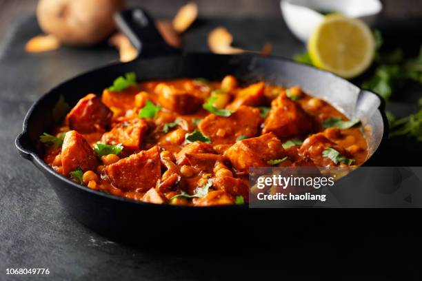 sweet potato and chickpea tikka masala - skillet stock pictures, royalty-free photos & images