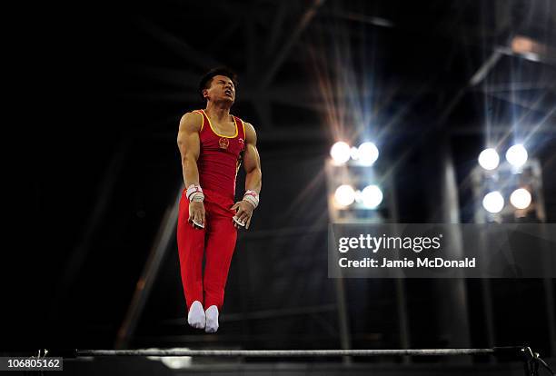 Yibing Chenof China competes in High Bar in the Artistic Gymnastics Men's Qualification and Team Final the at the Asian Games Town Gymnasium during...