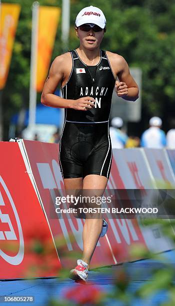 Mariko Adachi of Japan runs ahead of the field to win gold in the women's triathlon at the 16th Asian Games in Guangzhou on November 13, 2010....