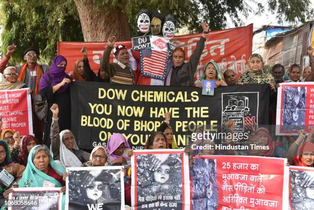 Activists along with survivors of the Bhopal gas tragedy stage a demonstration demanding more compensation on the 34th anniversary of Bhopal gas...