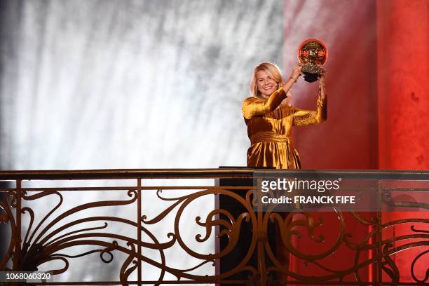 Olympique Lyonnais' Norwegian forward Ada Hegerberg brandishes her trophy after receiving the 2018 Women's Ballon d'Or award for best player of the...