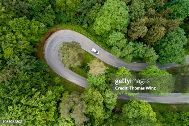 hairpin curve - coloured tarmac stock pictures, royalty-free photos & images