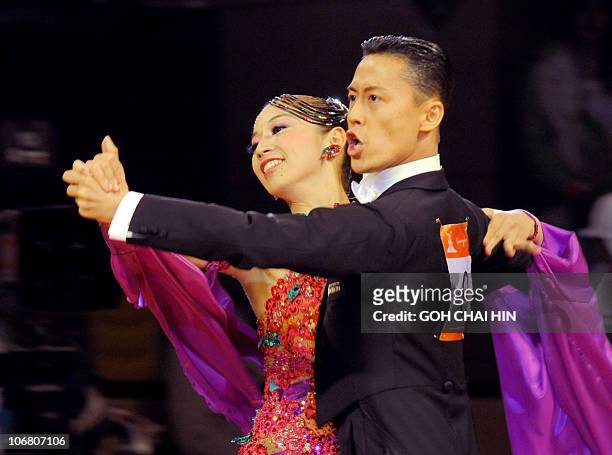 Ayami Kubo and Masayuki Ishihara of Japan compete in the dancesport standard quickstep event at the 16th Asian Games in Guangzhou on November 13,...