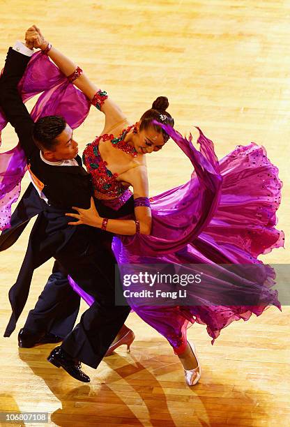 Ayami Kubo and Masayuki Ishihara of Japan compete in the the Standard-Quickstep of the Dance Sports at the Zengcheng Gymnasium during day one of the...