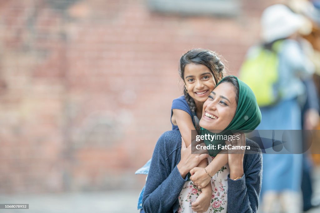 Riding On Mom's Shoulders