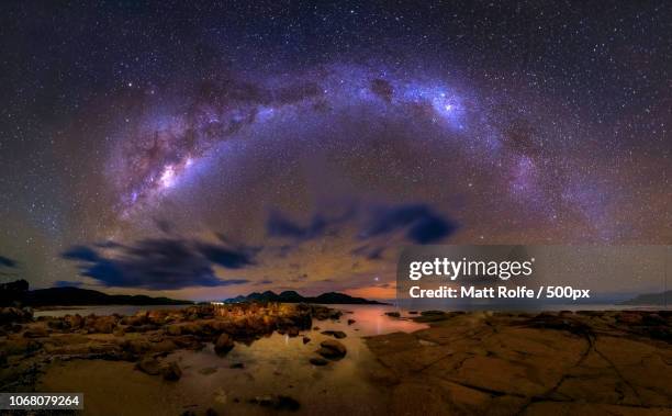 night sky with milky way over lake - wineglass bay stock pictures, royalty-free photos & images