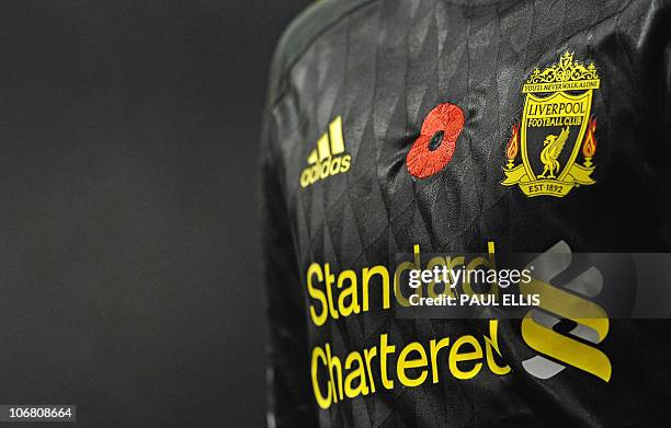 An embroidered remembrance poppy is seen on the shirt of a Liverpool player during the English Premier League football match between Stoke City and...