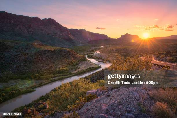 landscape with winding river at sunset - mountains dusk stock pictures, royalty-free photos & images