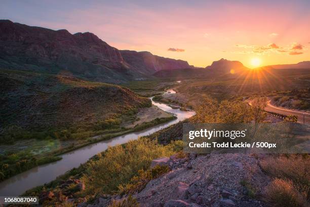 landscape with winding river at sunset - sunset landscape stock pictures, royalty-free photos & images