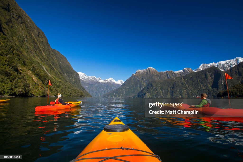 Women Kayaking in Milford Sound New Zealand